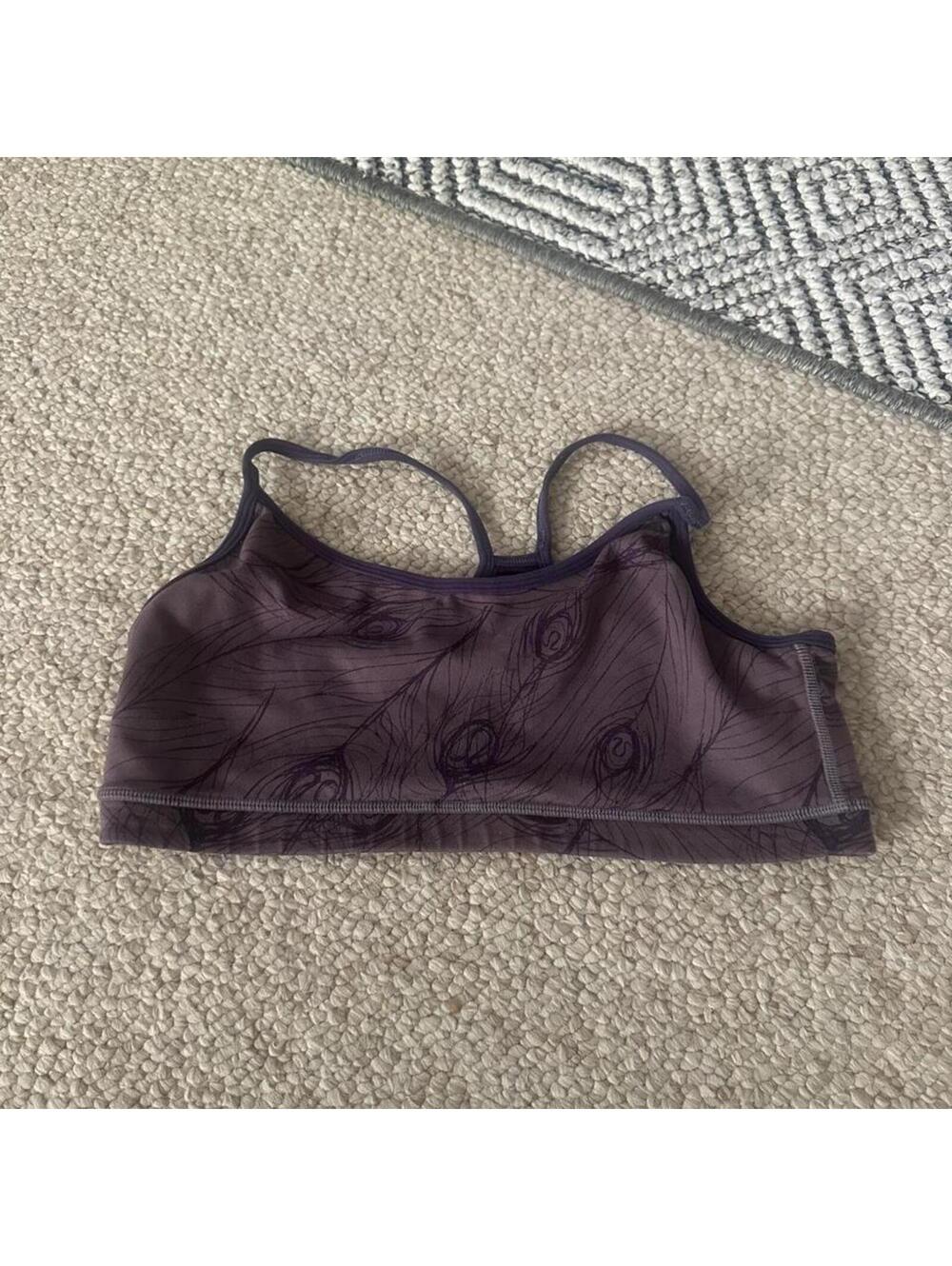 Purple Lululemon sports bra with dark gray feather pattern